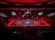 A red-lit LED glass floor stages a basketball game at BMW Park Munich.