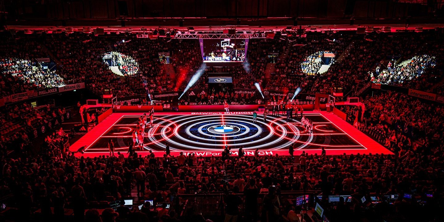 ASB Glass Floor BMW Park Season opening A red-lit LED glass floor stages a basketball game at BMW Park Munich.
