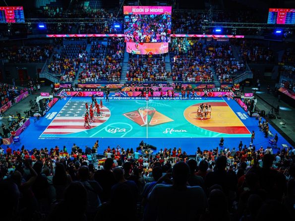 The USA and Spain face each other on a bright LED basketball court in Madrid.