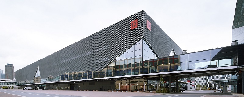 Modern exhibition hall 12 at Messe Frankfurt with glass façade and striking angular structure.