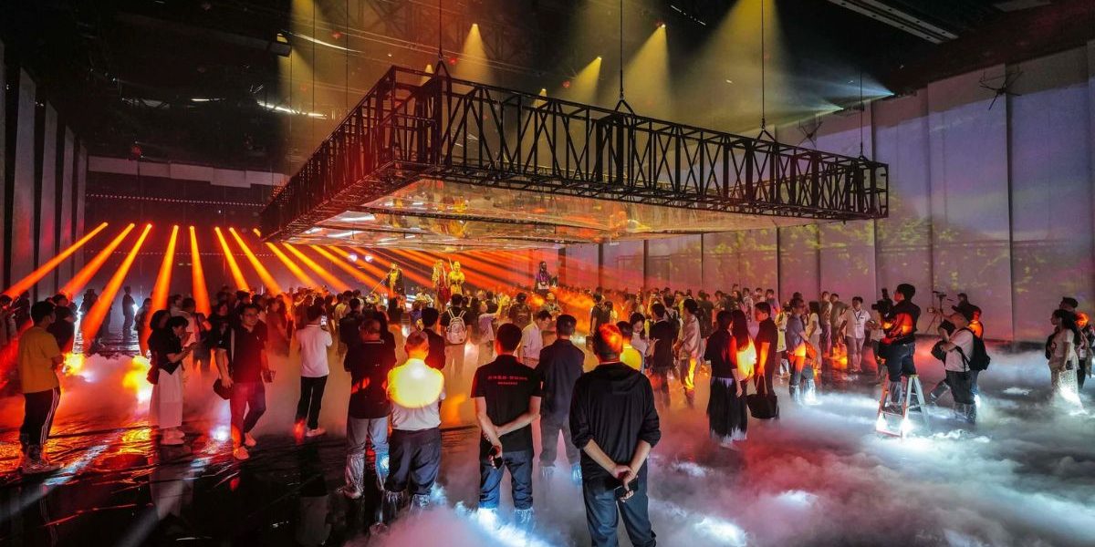 Light show with an audience, fog and trusses at Prolight + Sound Guangzhou