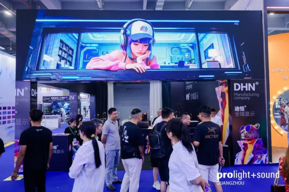 LED display at the DHN stand featuring trade visitors and digital imagery
