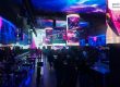 Stage area with large LED screens and guests